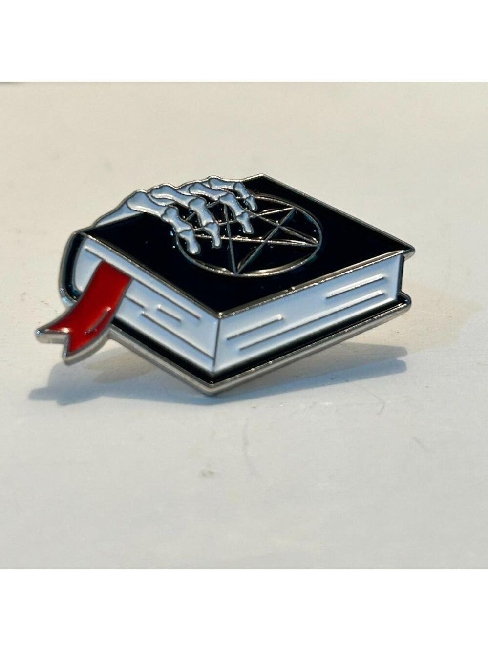 Creepy hand pin